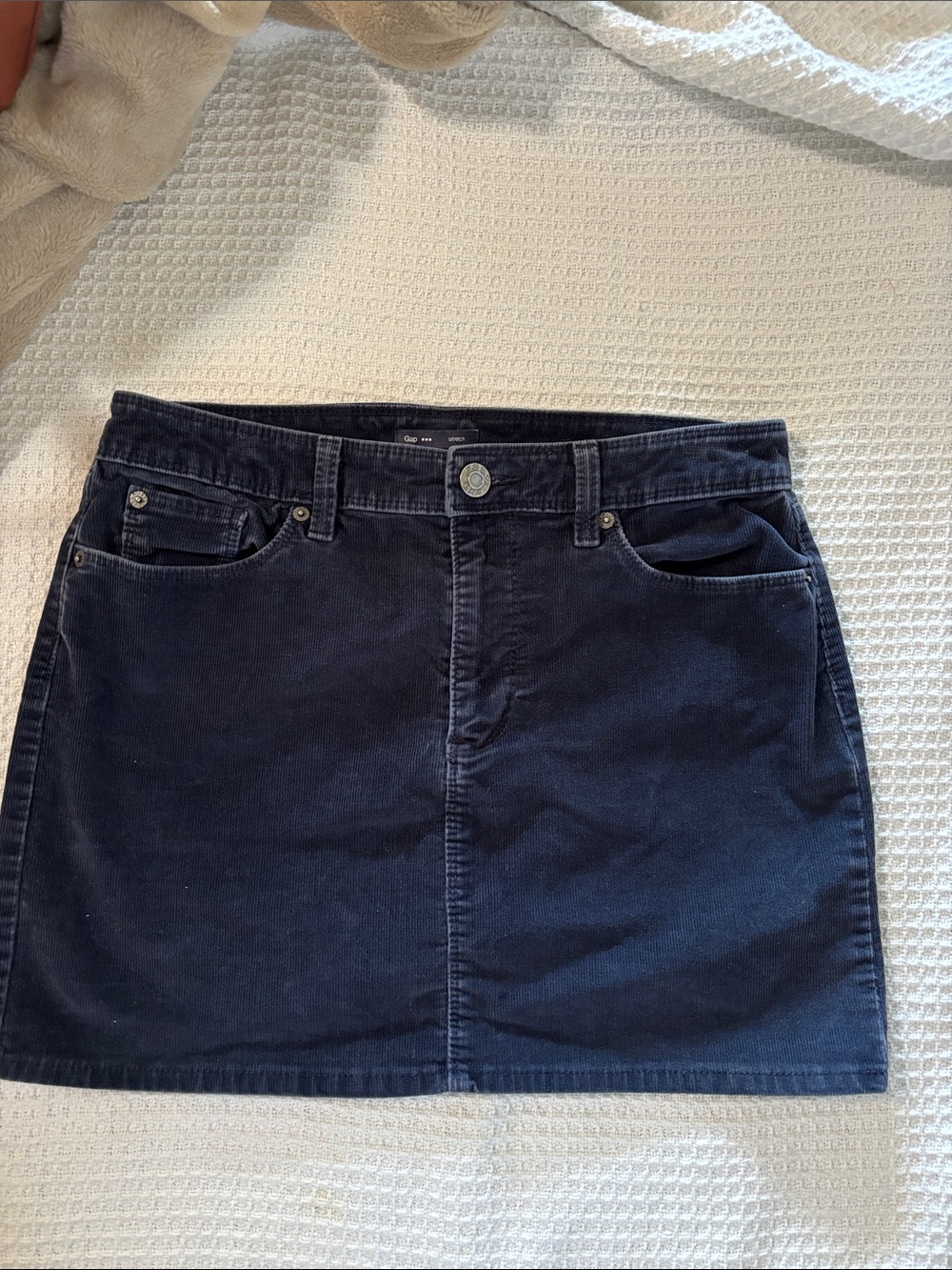 Love this navy blue corduroy mini skirt from the brand Gap.